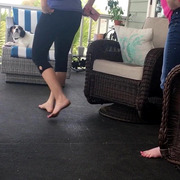 Wife and sister-in-law barefoot on the porch
